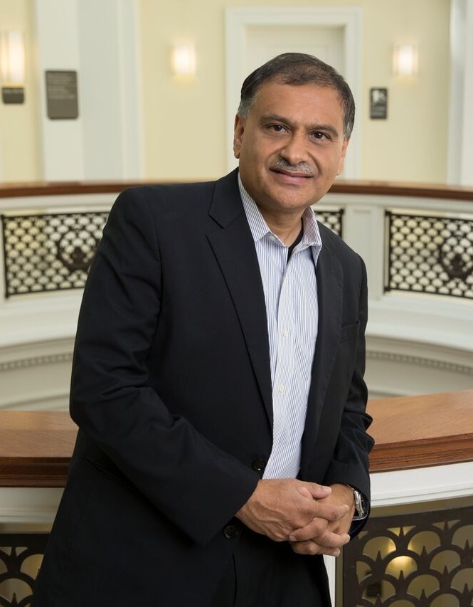 Vice Provost Raj Mehta stands in the atrium of Van Wormer Hall