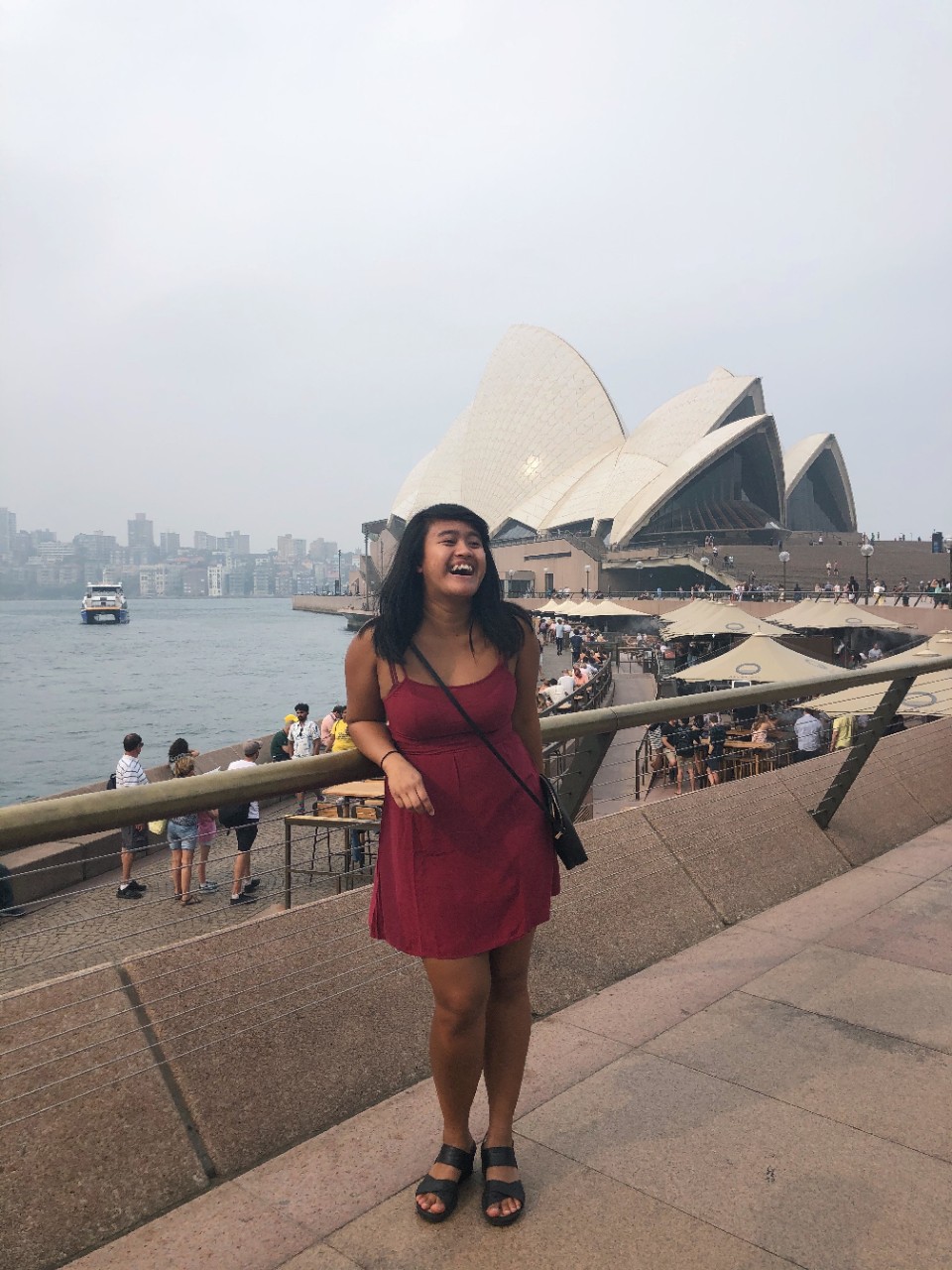 Ilma Alfadila stands in front of the Sydney Opera House in Sydney, Australia.